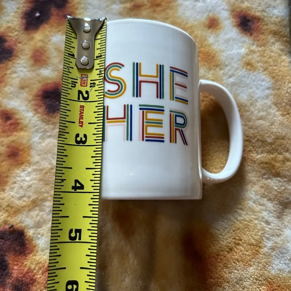 Room Essentials “She Her” coffee mug- white mug with rainbow text